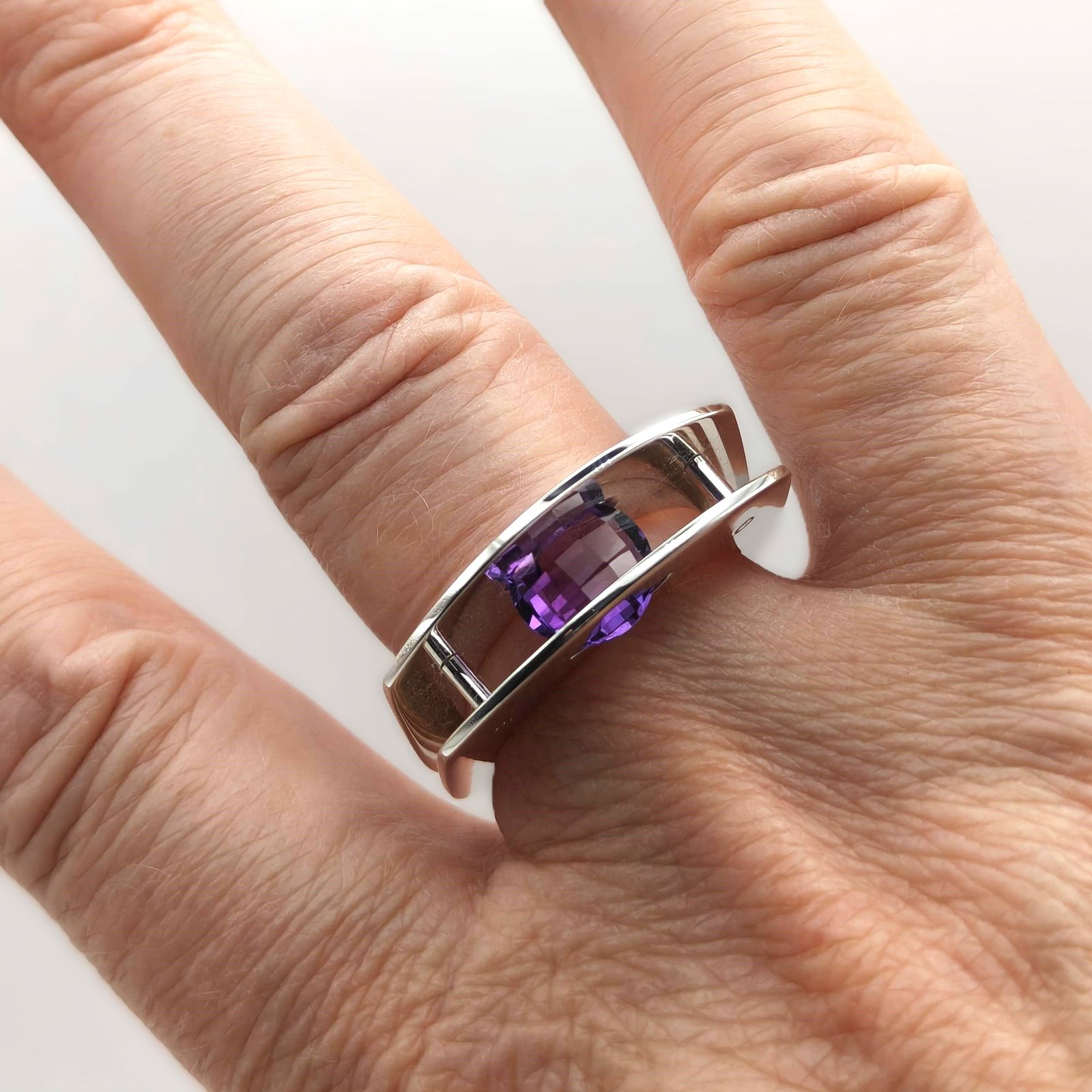 Suspension Ring No. 1 worn on the hand