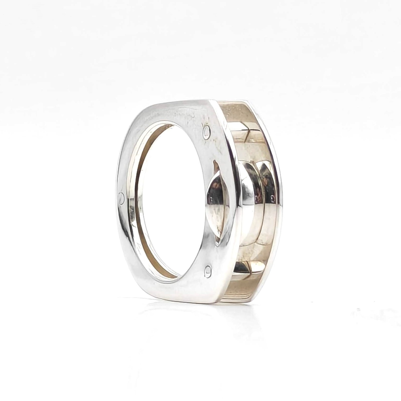 Polished sterling silver Suspension Ring exploring reflection and negative space